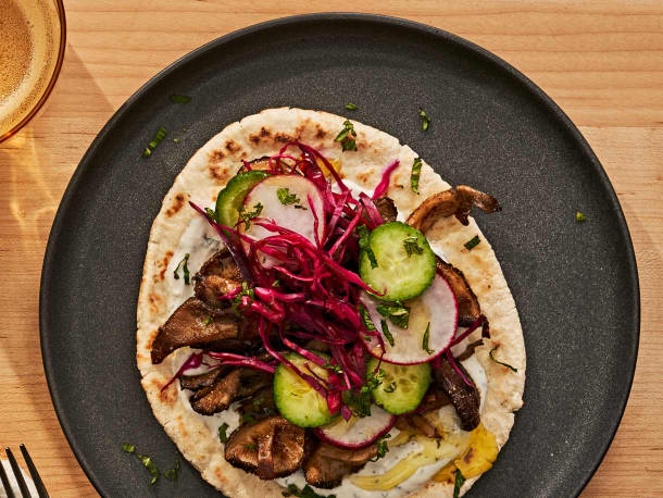 Falafel-Spiced Crispy Mushroom Pitas with Garlicky Yogurt