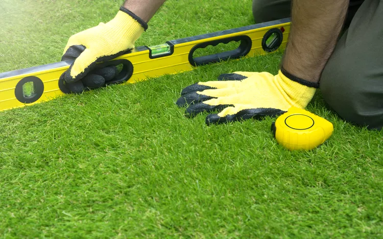 How to Level a Yard by Removing Bumps and Divots