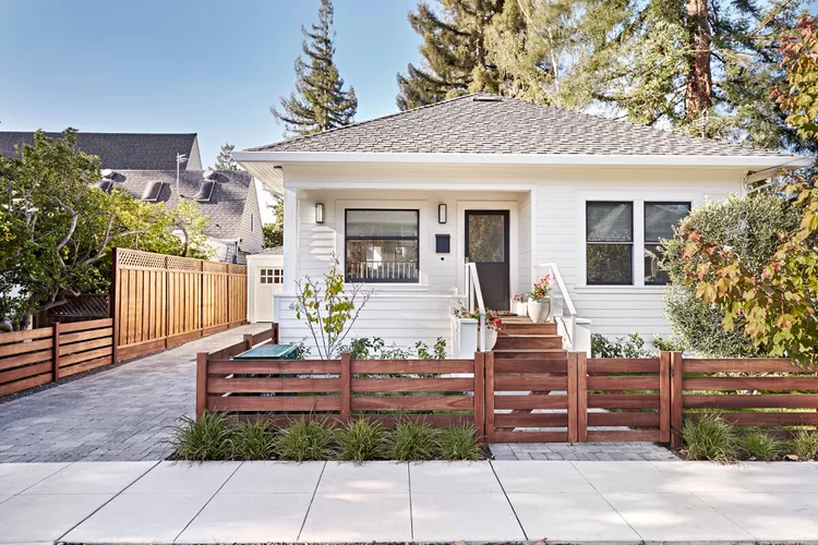 Can You Trim a Neighbor’s Tree That Hangs Over Your Yard? What a Lawyer Says